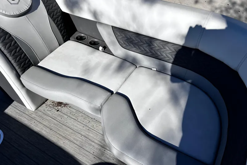 Slide: The Image of Luxurious seating on 2022 Godfrey Monaco 235 SFL boat with cup holders and stylish design. - 12