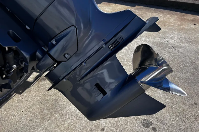 Slide: The Image of Close-up of a 2022 Godfrey Monaco 235 SFL boat motor and propeller. - 15