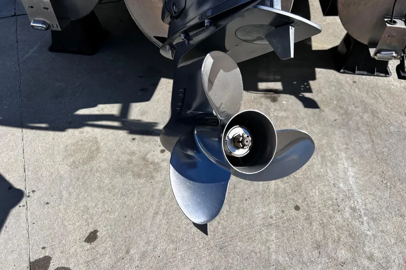 Slide: The Image of Propeller of 2022 Godfrey Monaco 235 SFL boat on concrete surface. - 18