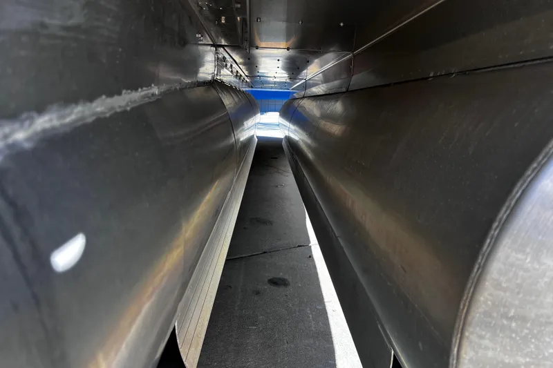 Slide: The Image of Underneath view of 2022 Godfrey Monaco 235 SFL pontoon boat, showcasing aluminum structure. - 19