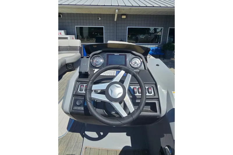 Slide: The Image of 2022 Godfrey Monaco 235 SFL pontoon boat with Yamaha outboard motor, docked outdoors. - 5