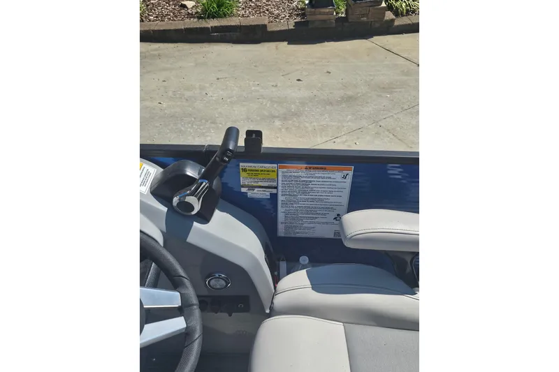 Slide: The Image of 2022 Godfrey Monaco 235 SFL pontoon boat interior with modern seating and steering console. - 7