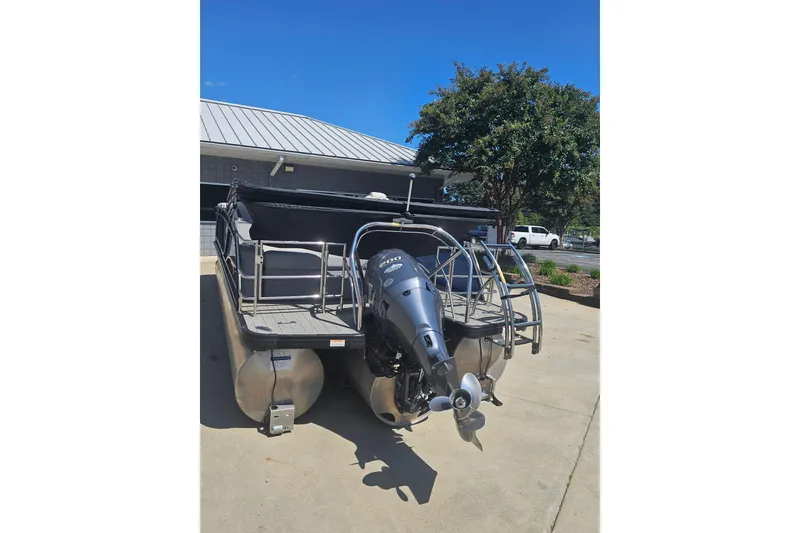 Slide: The Image of 2022 Godfrey Monaco 235 SFL boat interior with gray seating and cup holders. - 8