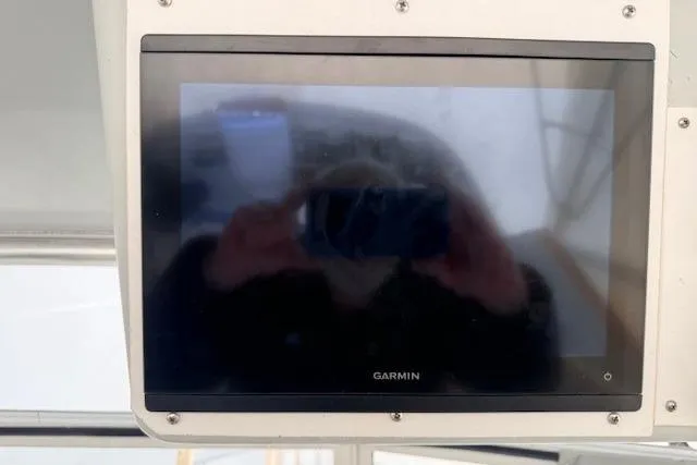 Slide: The Image of Garmin display on 1978 Dyer 40 Custom Express Cruiser dashboard. - 24