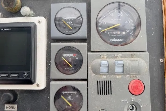 Slide: The Image of Control panel of 1978 Dyer 40 Custom Express Cruiser with gauges and switches. - 25