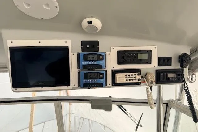 Slide: The Image of 1978 Dyer 40 Custom Express Cruiser dashboard with navigation and communication equipment. - 26