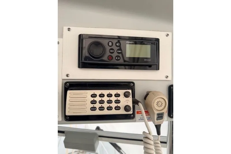 Slide: The Image of 1978 Dyer 40 Custom Express Cruiser control panel with radio and microphone. - 28