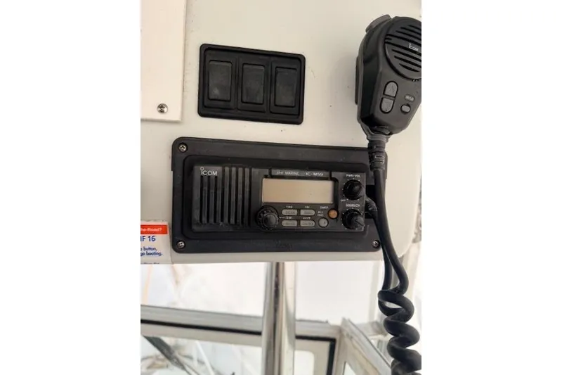 Slide: The Image of Radio equipment on a 1978 Dyer 40 Custom Express Cruiser boat dashboard. - 29