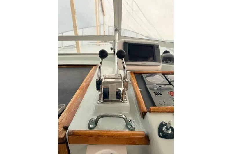 Slide: The Image of 1978 Dyer 40 Custom Express Cruiser helm with controls and navigation equipment. - 30