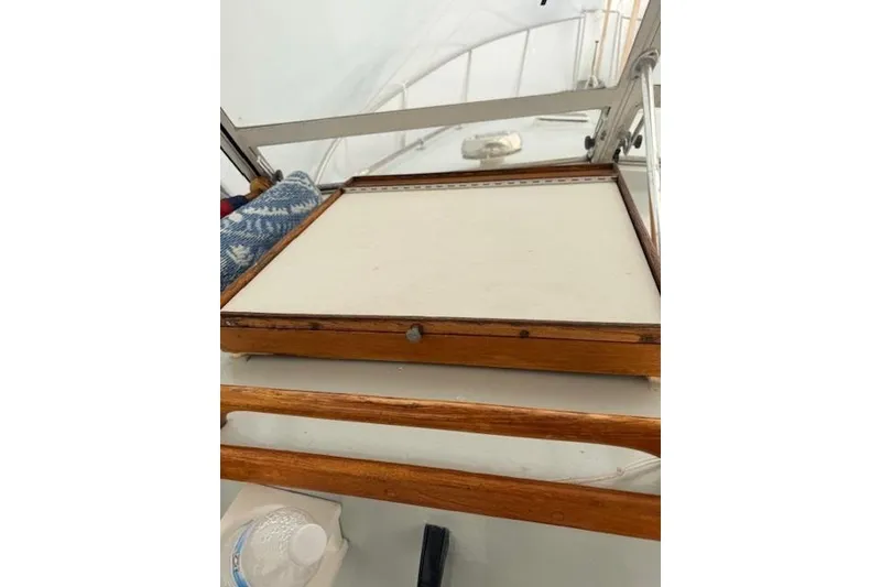 Slide: The Image of Interior view of a 1978 Dyer 40 Custom Express Cruiser with wooden details. - 34