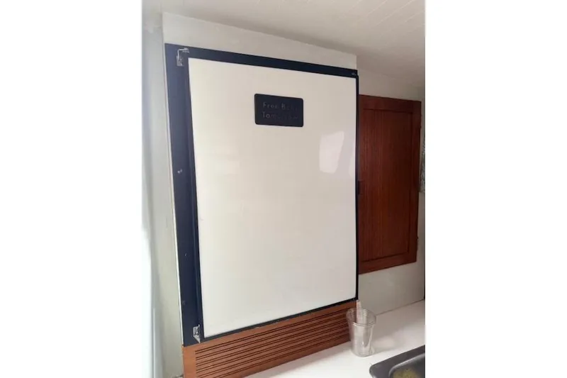 Slide: The Image of 1978 Dyer 40 Custom Express Cruiser interior with vintage refrigerator. - 43