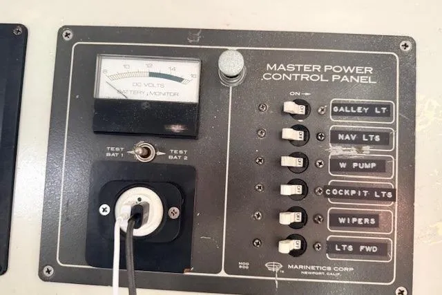 Slide: The Image of Master power control panel on 1978 Dyer 40 Custom Express Cruiser with switches and voltmeter. - 49