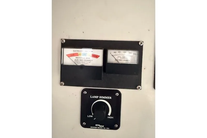 Slide: The Image of Control panel with gauges and lamp dimmer on 1978 Dyer 40 Custom Express Cruiser. - 51