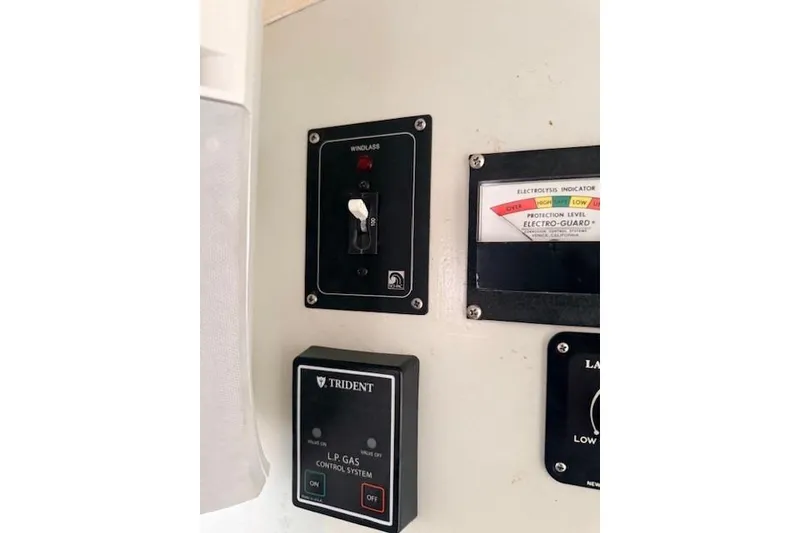 Slide: The Image of Control panel on a 1978 Dyer 40 Custom Express Cruiser with windlass and gas system. - 52