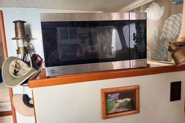 Slide: The Image of Microwave on a Dyer 40 Custom Express Cruiser, 1978, with nautical decor. - 53