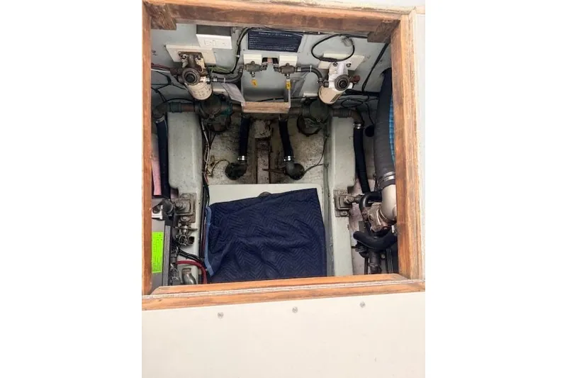 Slide: The Image of Engine compartment of a 1978 Dyer 40 Custom Express Cruiser, showing mechanical components. - 66