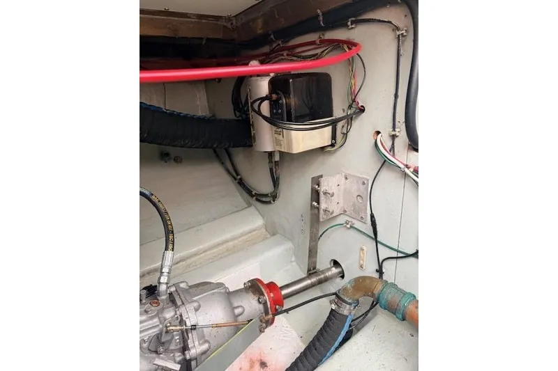 Slide: The Image of Engine compartment of 1978 Dyer 40 Custom Express Cruiser with visible wiring and components. - 67