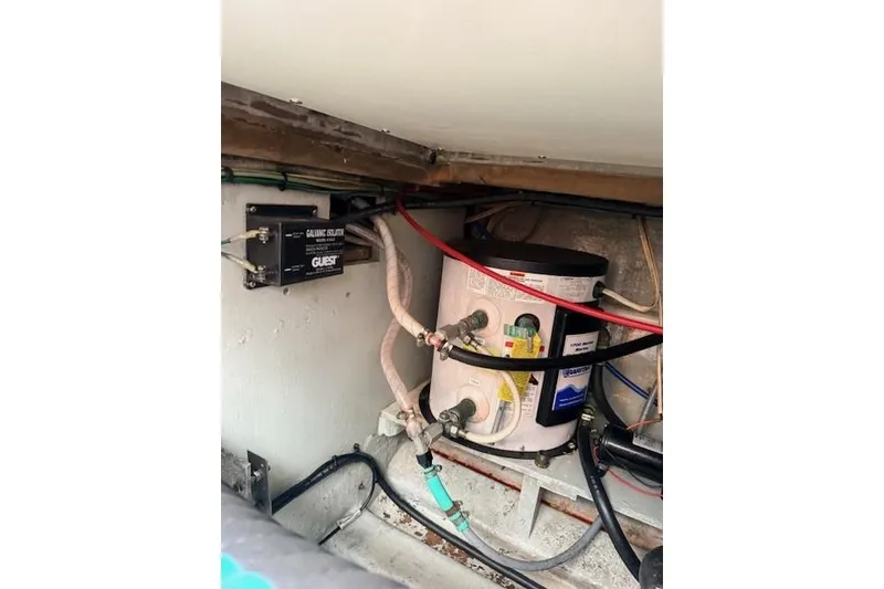 Slide: The Image of Electrical and plumbing components inside a 1978 Dyer 40 Custom Express Cruiser. - 69