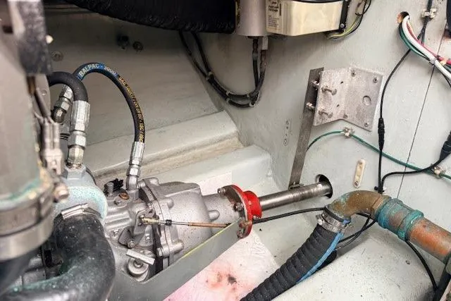 Slide: The Image of Engine compartment of a 1978 Dyer 40 Custom Express Cruiser, showing mechanical components and wiring. - 71