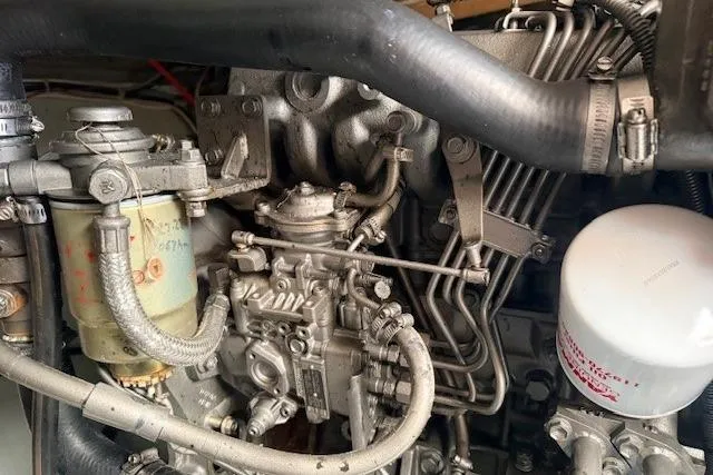 Slide: The Image of Engine components of a 1978 Dyer 40 Custom Express Cruiser, showcasing intricate mechanical details. - 74