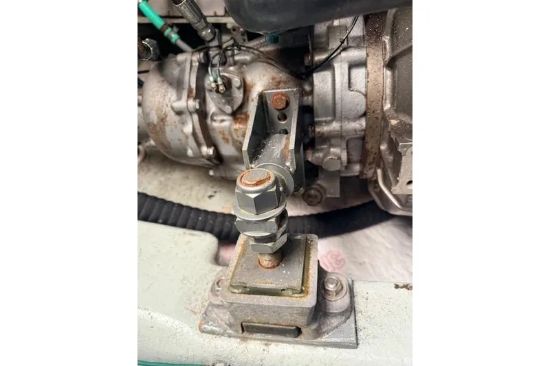Slide: The Image of Engine component of a 1978 Dyer 40 Custom Express Cruiser, showing rust and wear. - 76