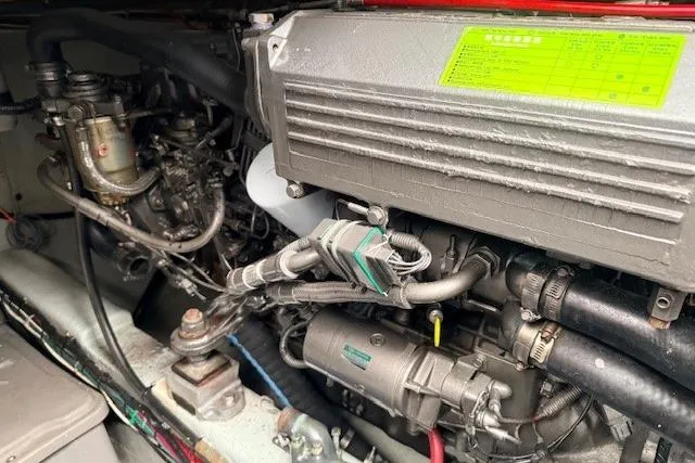 Slide: The Image of Engine compartment of a 1978 Dyer 40 Custom Express Cruiser, showcasing mechanical components. - 78