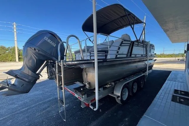 Slide: The Image of 2024 Starcraft SLS 3 Q DH pontoon boat with Yamaha outboard engine on trailer. - 3
