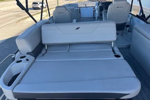 Slide: The Image of 2024 Starcraft SLS 3 Q DH boat interior with spacious seating and cup holders. - 4