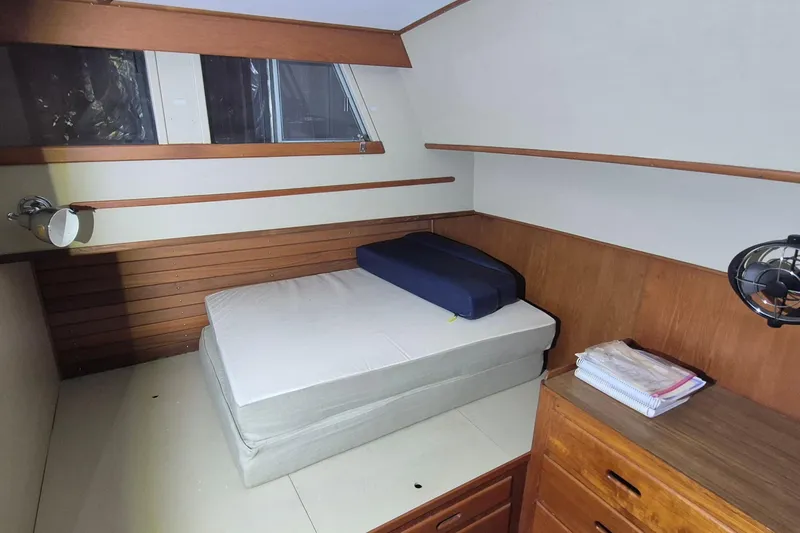 Slide: The Image of Cabin interior of 1985 Grand Banks 42 Classic with bed and wooden furnishings. - 13