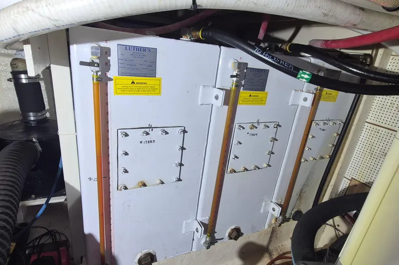 Slide: The Image of Engine room of 1985 Grand Banks 42 Classic with fuel tanks and gauges. - 32