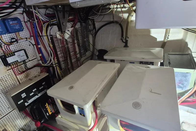 Slide: The Image of Engine room of 1985 Grand Banks 42 Classic with wiring and equipment. - 41