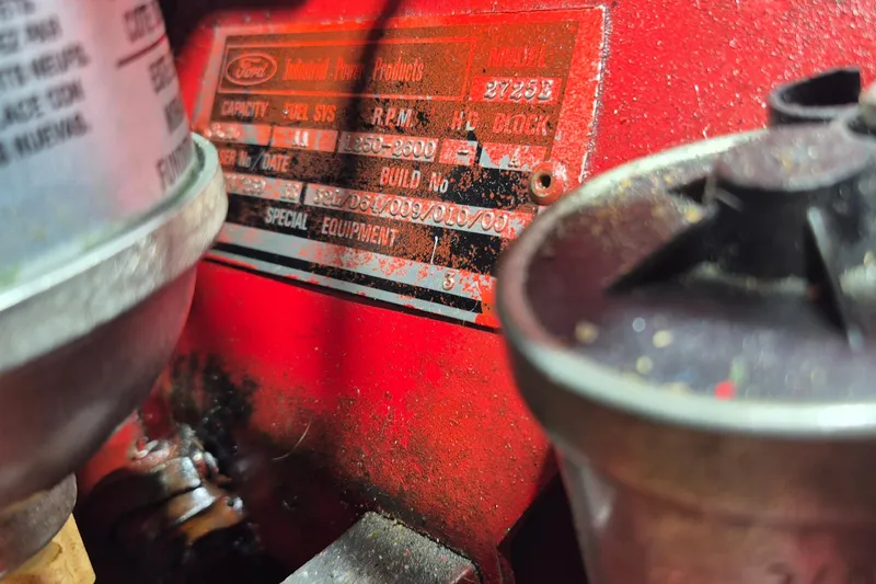 Slide: The Image of Close-up of a Ford engine label on a 1985 Grand Banks 42 Classic boat. - 47