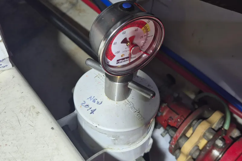 Slide: The Image of Engine room gauge on 1985 Grand Banks 42 Classic boat, labeled "New 2014." - 53