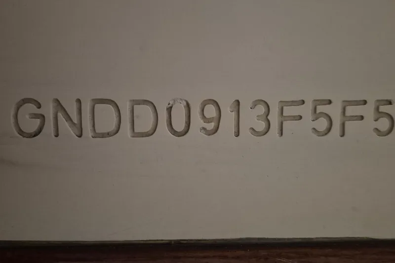 Slide: The Image of Hull identification number on 1985 Grand Banks 42 Classic boat. - 67