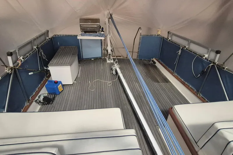 Slide: The Image of 1985 Grand Banks 42 Classic yacht deck with seating, grill, and storage. - 74