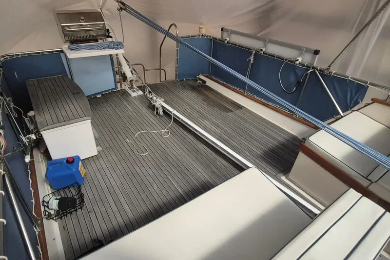 Slide: The Image of 1985 Grand Banks 42 Classic yacht deck with seating, grill, and storage. - 76