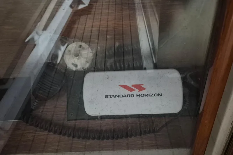 Slide: The Image of Standard Horizon radio on 1985 Grand Banks 42 Classic boat deck. - 77