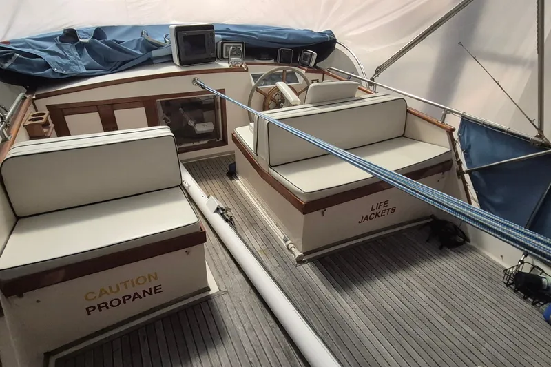 Slide: The Image of Interior of 1985 Grand Banks 42 Classic boat with seating and safety storage. - 78