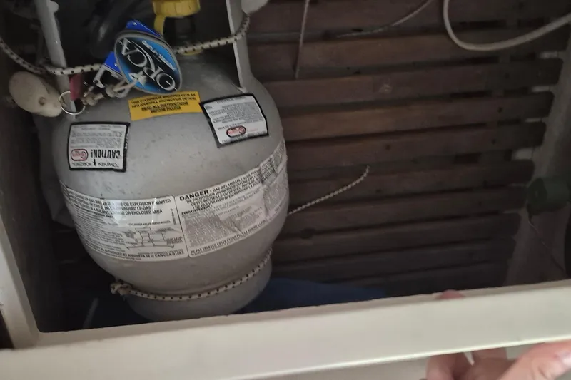 Slide: The Image of Propane tank in 1985 Grand Banks 42 Classic boat interior compartment. - 84