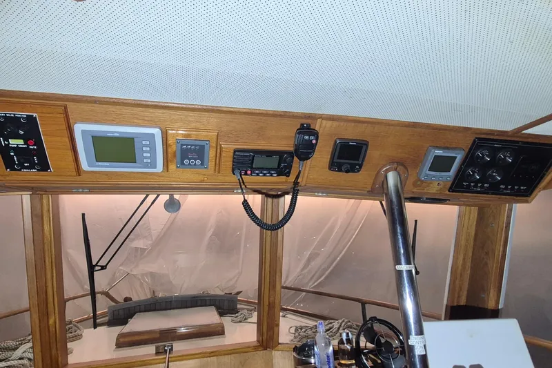 Slide: The Image of Control panel of a 1985 Grand Banks 42 Classic boat with navigation instruments. - 9