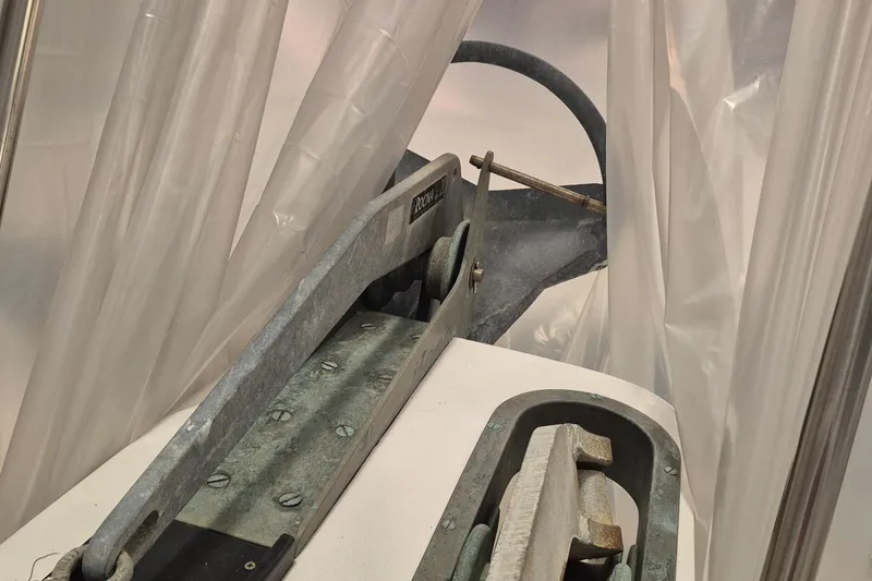 Slide: The Image of Anchor mechanism on 1985 Grand Banks 42 Classic yacht, partially covered by plastic sheeting. - 95