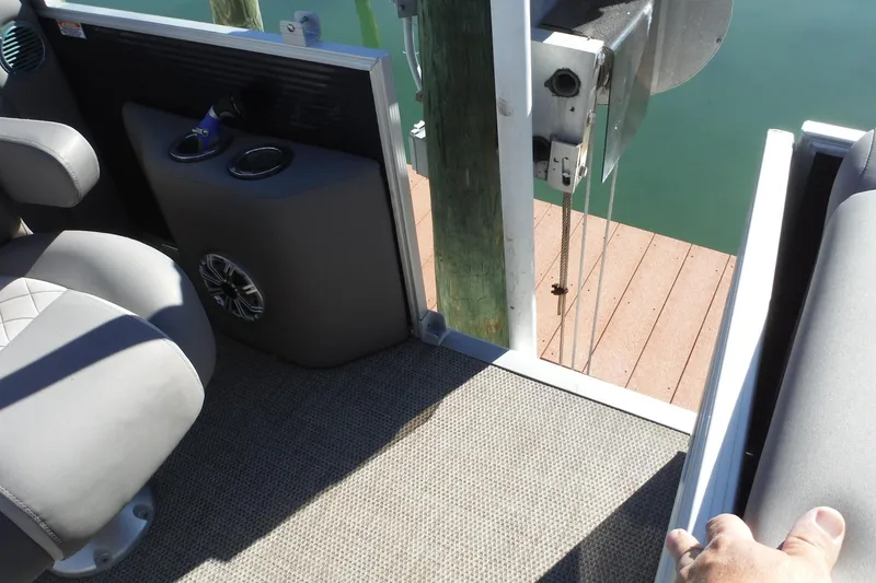 Slide: The Image of 2019 Bennington SX 22 SSRX boat interior with seating and dock view. - 13