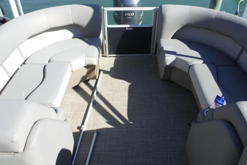 Slide: The Image of 2019 Bennington SX 22 SSRX pontoon boat interior with gray seating and carpeted floor. - 15