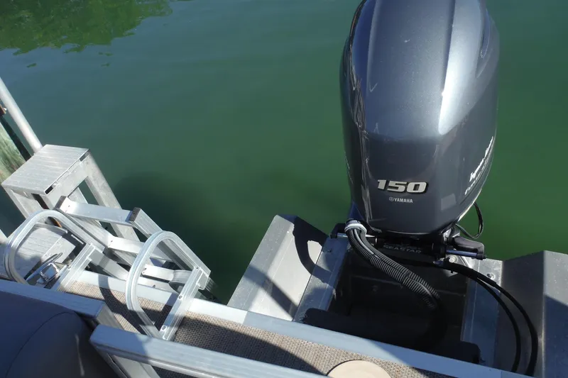 Slide: The Image of 2019 Bennington SX 22 SSRX with Yamaha 150 outboard motor on calm water. - 17