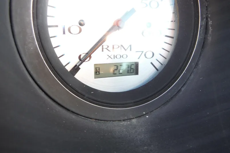 Slide: The Image of Close-up of 2019 Bennington SX 22 SSRX RPM gauge displaying 227.6 hours. - 19