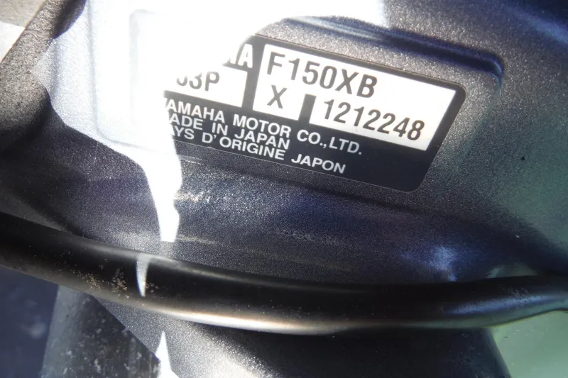 Slide: The Image of Close-up of Yamaha motor label on 2019 Bennington SX 22 SSRX. - 21