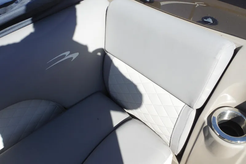 Slide: The Image of 2019 Bennington SX 22 SSRX boat interior with cushioned seating and cup holder. - 23