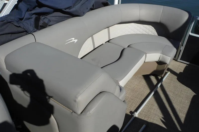 Slide: The Image of 2019 Bennington SX 22 SSRX boat interior with gray cushioned seating. - 26