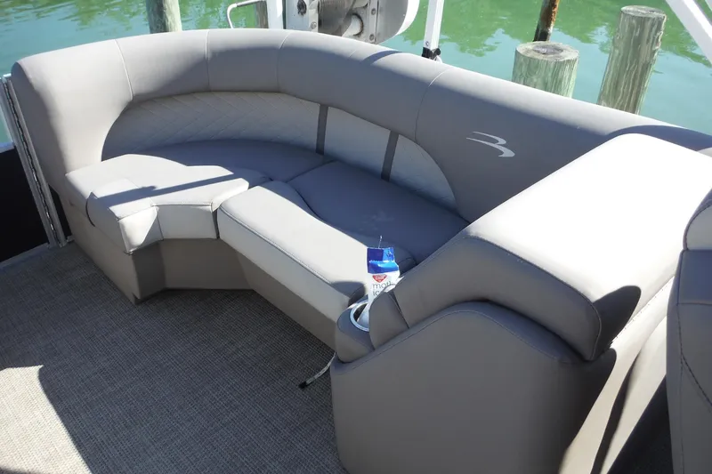Slide: The Image of 2019 Bennington SX 22 SSRX pontoon boat interior with gray seating and cup holder. - 27
