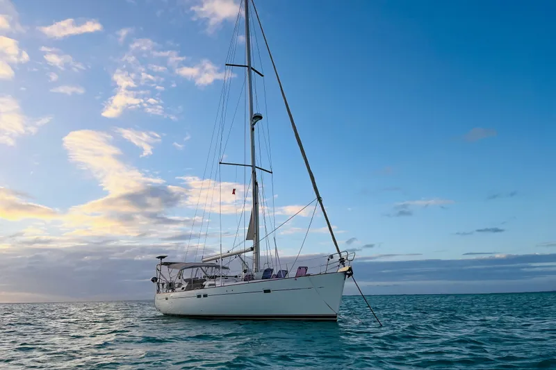The Image of Sailing yacht Beneteau 473, 2001 model, anchored on calm ocean at sunset. - 0